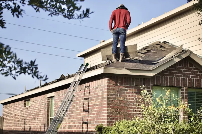 Professional roofer working on a residential roof in North Strabane